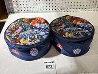 Two round Skylanders Spyro's Adventure carry bags closed