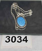 Pendant on chain overall view with lot number