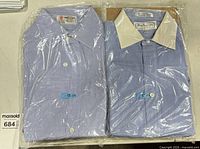 Both packaged shirts side by side