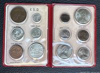 Front view of the complete 12-coin changeover set in vinyl holder