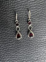 Front view of both earrings showing design and stones