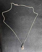 Full view of sterling silver necklace with pendant