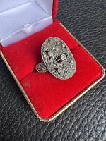 Top view of oval marcasite sterling silver ring in box