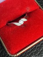 Ring in red box, full view of band and stone