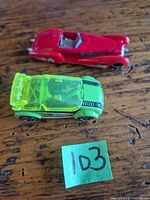 Top view of both Hot Wheels cars showing colors and design