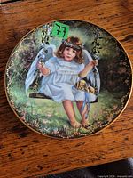 Front view of porcelain plate showing angel artwork