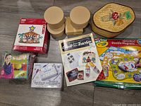 Overview showing all craft items including kits, paper-mâché boxes, straw basket