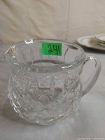 Angled view showing body, handle and diamond pattern