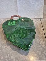 Top view of green leaf dish showing glaze and handle