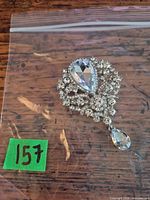 Front view showing rhinestone arrangement and dangle