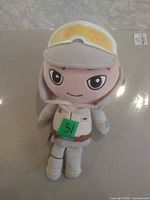 Front view of Luke Skywalker plush showing suit, helmet, face
