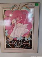 Full view of framed swan floral artwork