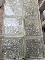 Close view of bubble-pattern glass block faces