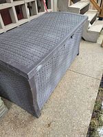 Closed resin wicker-pattern deck box