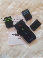 Key finder transmitter, three receiver tags, instruction sheet