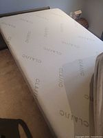 Twin memory foam mattress on bed frame showing top surface