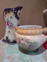 Chocolate pot and Austrian pot side by side