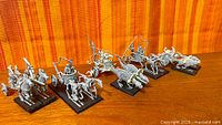 Full lot showing six assembled chariots on bases