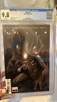 Front view of CGC-slabbed Alien #1 showing grade label 9.8 and cover art