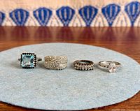 All four sterling silver rings lined up