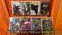 Eight comic books displayed on rack, top row Hellspawn 1-4, bottom row Spawn/Wildcats 1-4