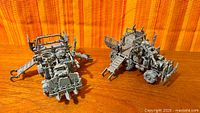 Two assembled Ork Trukks side by side on tabletop