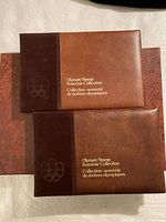 Two brown Olympic Stamp Souvenir Collection books