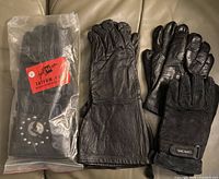 Four pairs of gloves including packaged Jafrum, Barrie gauntlet, unnamed leather, Cherokee suede