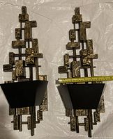 Front view of both sconces showing design and cups