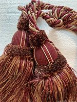 Close-up of two tassels showing color and material