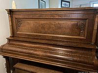 Front view of Mason & Risch upright piano cabinet