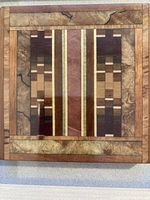 Close view of inlaid wood mosaic detailing