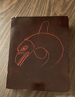 wooden box exterior with orca design