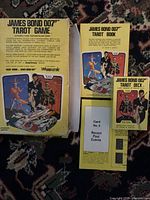 Outer yellow storage box, instruction booklet, and card deck visible