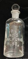 Front view showing embossed text DIL. ACID SULFURIC H2SO4