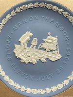 Full view of the Wedgwood Apollo 11 plate showing design and inscription