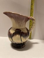 Profile view showing overall form, glaze, ruler for height reference