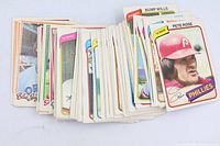 Fronts of assorted O-Pee-Chee baseball cards spread in fan, showing variety including Pete Rose and Bump Wills.