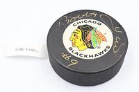 Top view showing Chicago Blackhawks logo and Bobby Hull gold signature