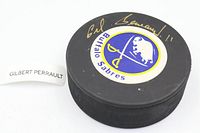 Autographed side showing Buffalo Sabres logo and Gilbert Perreault signature