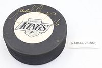 Side with Los Angeles Kings decal and gold Marcel Dionne signature #16