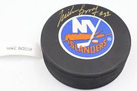Front view showing New York Islanders logo and gold Mike Bossy signature #22
