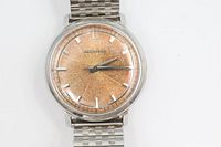 Front view showing orange tropical dial, hands, markers and case condition