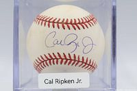 Front view of baseball showing Cal Ripken Jr signature inside display cube