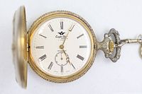 Open hunter pocket watch showing dial, case, and attached chain