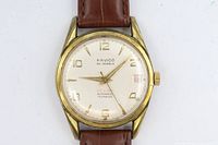 Front view silver dial gold-tone case brown strap