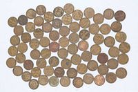Full lot of coins spread out, showing quantity and overall condition