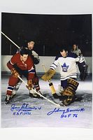 Signed hockey action photograph with visible dual autographs