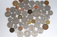 Top view of entire assortment of mixed coins showing quantity and variety