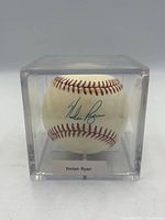 Autographed baseball signed by Nolan Ryan inside acrylic cube